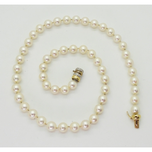 2801 - A STRING OF PEARLScreamy pink in colour, each pearl approx 7.2mm, length 47.5cm, with a diamond set ... 