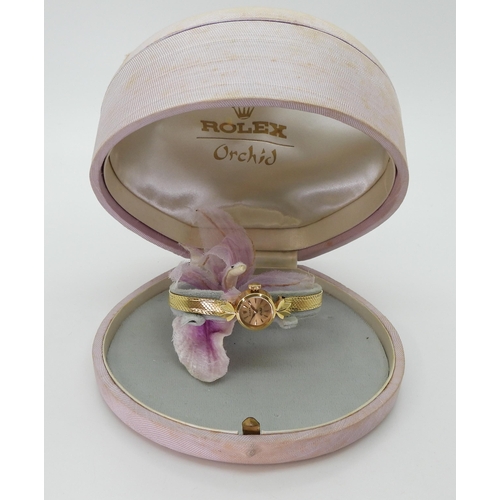 2906 - AN 18CT GOLD LADIES ROLEX ORCHIDthe gold coloured dial with gold baton numerals and hands, is signed... 