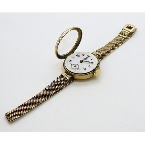 2913 - A LADIES VINTAGE ROLEXin 9ct gold, the white dial with subsidiary seconds dial blued steel hands, an... 