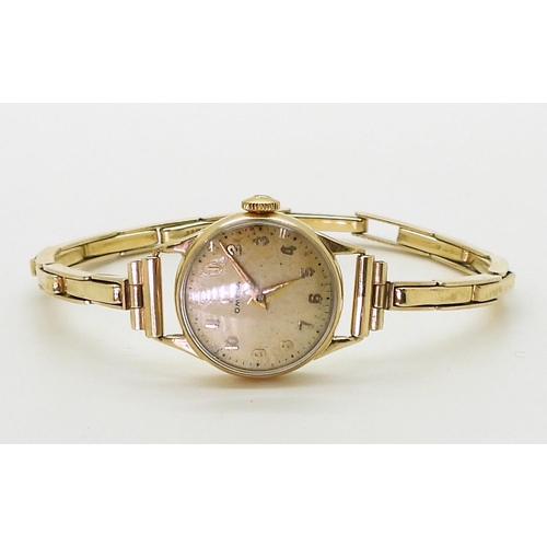 2914 - A LADIES OMEGA WRISTWATCHboth the case and the strap are in 9ct gold, inscribed and dated 1955, Birm... 