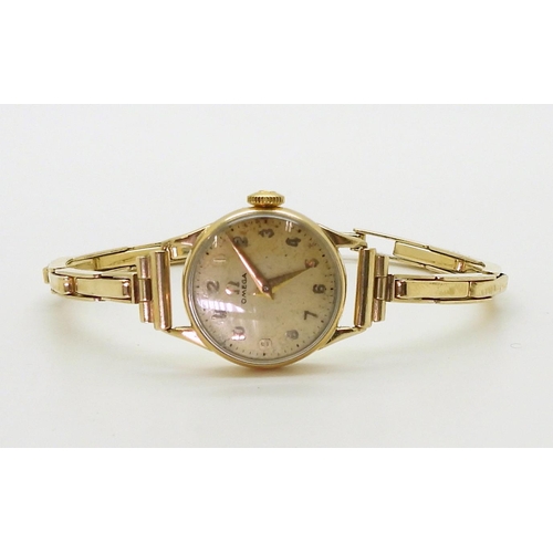 2914 - A LADIES OMEGA WRISTWATCHboth the case and the strap are in 9ct gold, inscribed and dated 1955, Birm... 