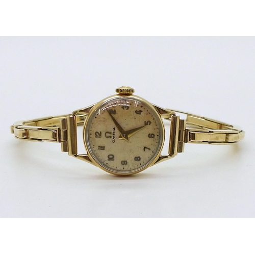 2914 - A LADIES OMEGA WRISTWATCHboth the case and the strap are in 9ct gold, inscribed and dated 1955, Birm... 