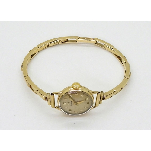 2914 - A LADIES OMEGA WRISTWATCHboth the case and the strap are in 9ct gold, inscribed and dated 1955, Birm... 