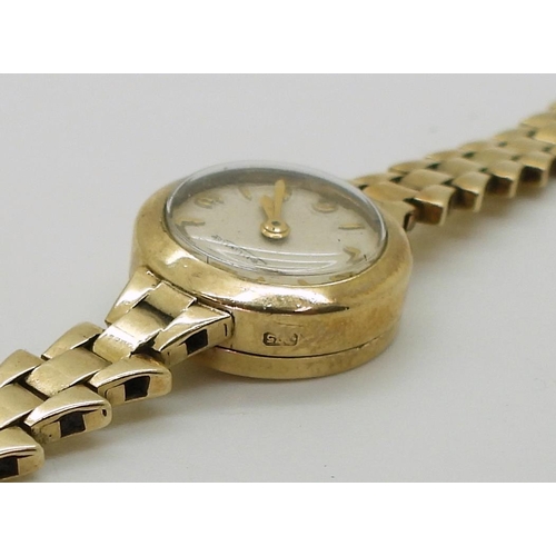 2917 - A LADIES JAEGER LECOULTRE WATCHin 9ct gold with a fancy link strap, the cream dial with Arabic and b... 