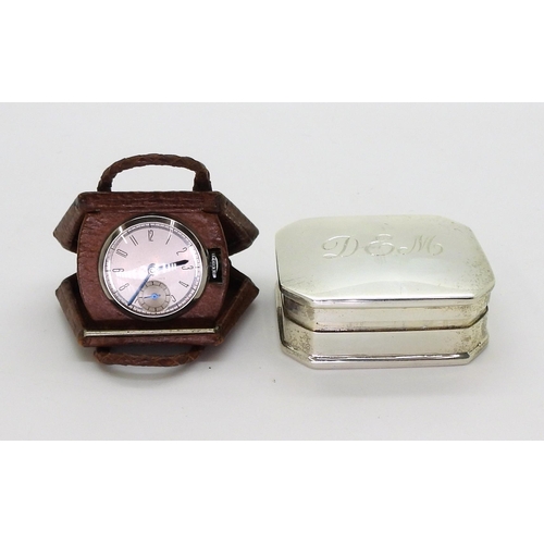 2918 - A NOVELTY WATCH AND A SILVER PILL BOXthe watch in a leather handbag shaped case flips open to reveal... 