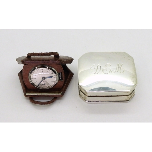 2918 - A NOVELTY WATCH AND A SILVER PILL BOXthe watch in a leather handbag shaped case flips open to reveal... 