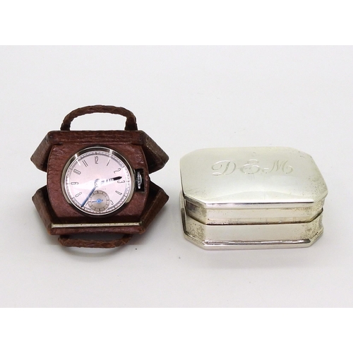 2918 - A NOVELTY WATCH AND A SILVER PILL BOXthe watch in a leather handbag shaped case flips open to reveal... 