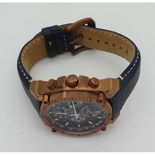 A GENTS BULOVA WATCHwith copper coloured case, blue dial with four ...