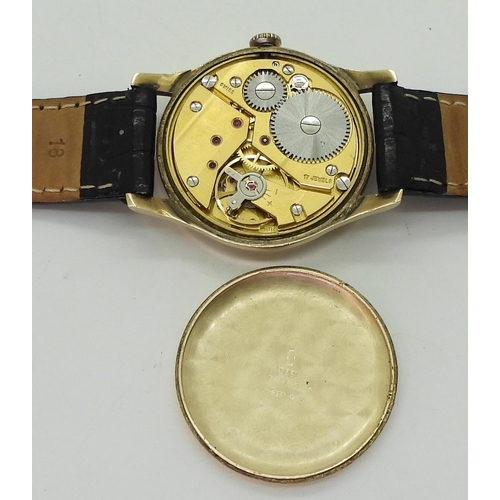 2929 - A 9CT GOLD GARRARD WATCHwith cream dial, subsidiary seconds dial, gold Arabic numerals and hands. Di... 