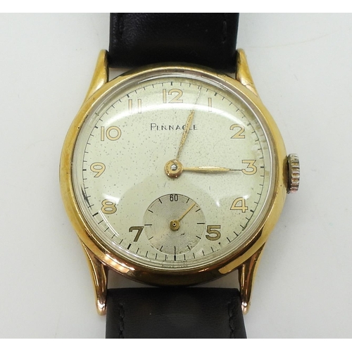 2930 - A 9CT GOLD PINNACLE WRISTWATCHwith cream dial, subsidiary seconds dial, gold coloured Arabic numeral... 