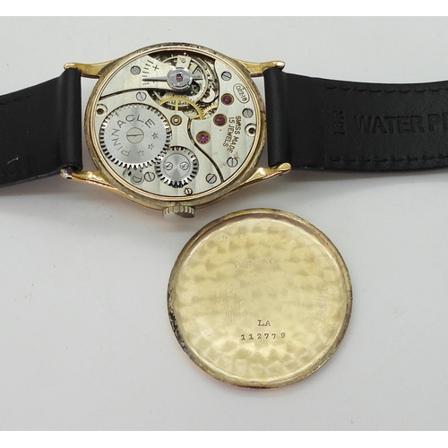 2930 - A 9CT GOLD PINNACLE WRISTWATCHwith cream dial, subsidiary seconds dial, gold coloured Arabic numeral... 