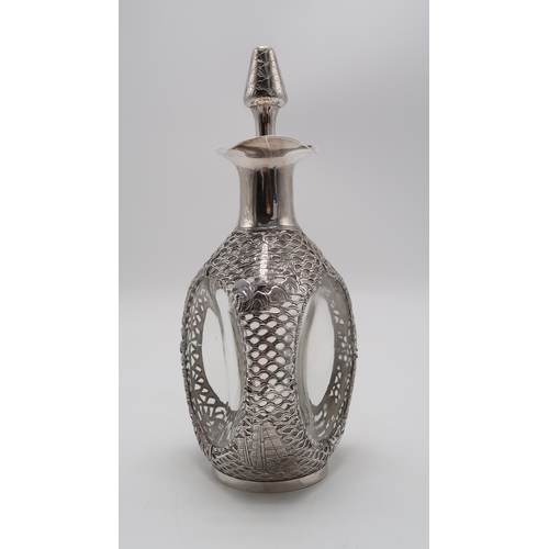 2302A - A CHINESE EXPORT SILVER OVERLAID DIMPLE DECANTERstamped Sterling and with maker's mark, the 'Haig' d... 