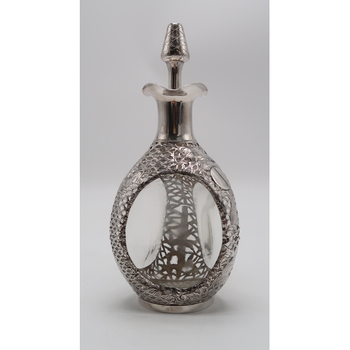 2302A - A CHINESE EXPORT SILVER OVERLAID DIMPLE DECANTERstamped Sterling and with maker's mark, the 'Haig' d... 