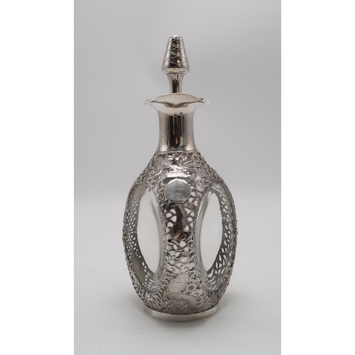 2302A - A CHINESE EXPORT SILVER OVERLAID DIMPLE DECANTERstamped Sterling and with maker's mark, the 'Haig' d... 