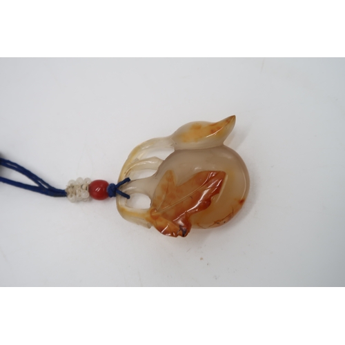 2330 - THREE CHINESE HARDSTONE PENDANT NECKLACESa fruit, 3.5cm long, figure, 4cm long and oxen, 4cm wide (3... 