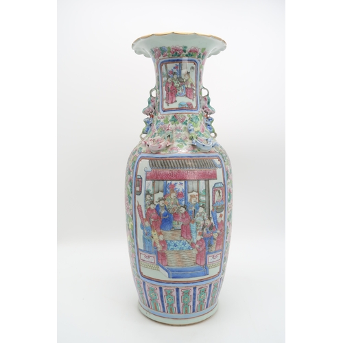 2327 - A LARGE CANTON BALUSTER VASE painted with panels of mandarins and courtiers on pavillions,flanked by... 