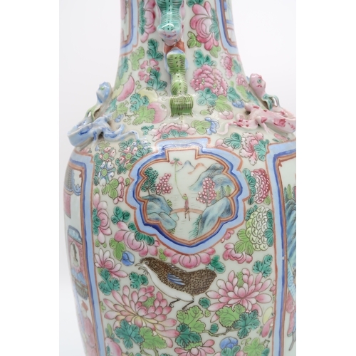 2327 - A LARGE CANTON BALUSTER VASE painted with panels of mandarins and courtiers on pavillions,flanked by... 