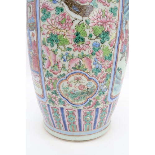 2327 - A LARGE CANTON BALUSTER VASE painted with panels of mandarins and courtiers on pavillions,flanked by... 