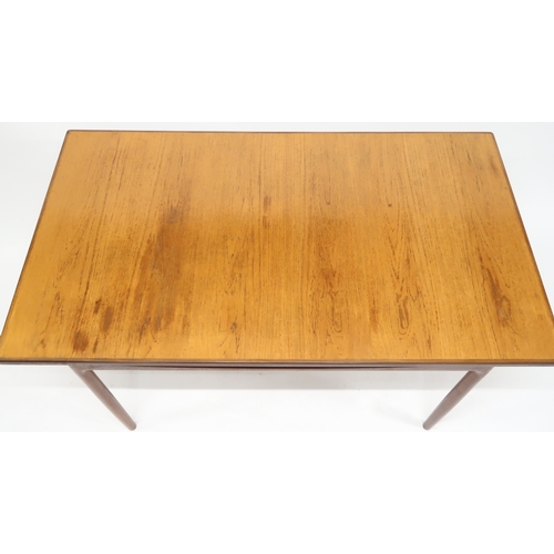 2102A - A MID 20TH CENTURY TEAK KOFOD LARSEN FOR G PLAN DINING SUITE comprising rectangular top table w... 