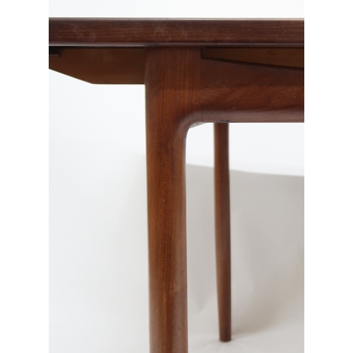 2102A - A MID 20TH CENTURY TEAK KOFOD LARSEN FOR G PLAN DINING SUITE comprising rectangular top table w... 