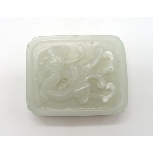 2328 - A CHINESE HARDSTONE PENDANT BROOCHcarved with calligraphy and in a white metal mount, 22.42 grams, 4... 