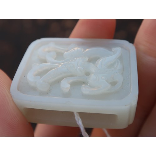 2328 - A CHINESE HARDSTONE PENDANT BROOCHcarved with calligraphy and in a white metal mount, 22.42 grams, 4... 