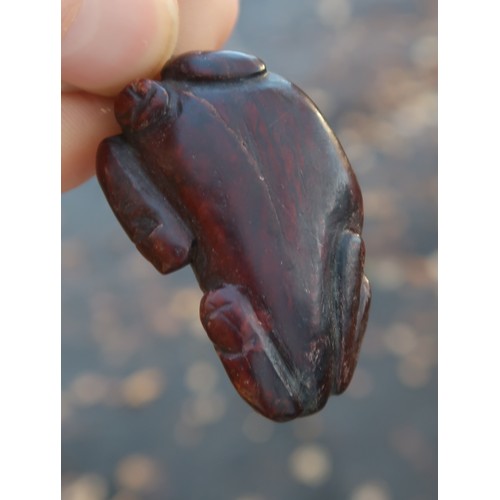 2330 - THREE CHINESE HARDSTONE PENDANT NECKLACESa fruit, 3.5cm long, figure, 4cm long and oxen, 4cm wide (3... 