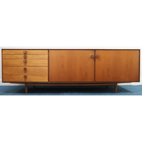 2102B - A MID 20TH CENTURY TEAK KOFOD LARSEN FOR G PLAN SIDEBOARD with bank of five graduating drawers along... 