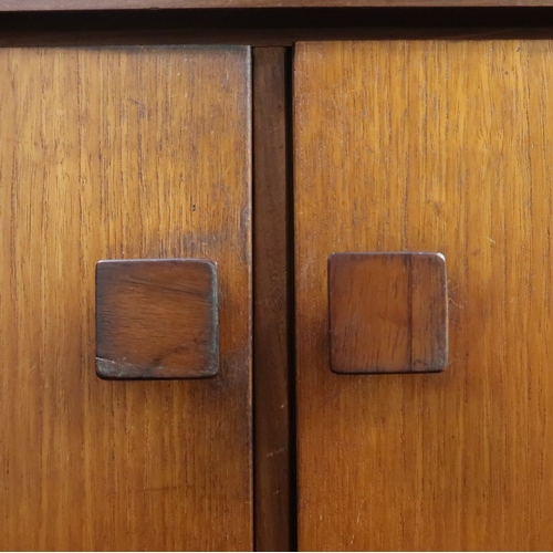 2102B - A MID 20TH CENTURY TEAK KOFOD LARSEN FOR G PLAN SIDEBOARD with bank of five graduating drawers along... 