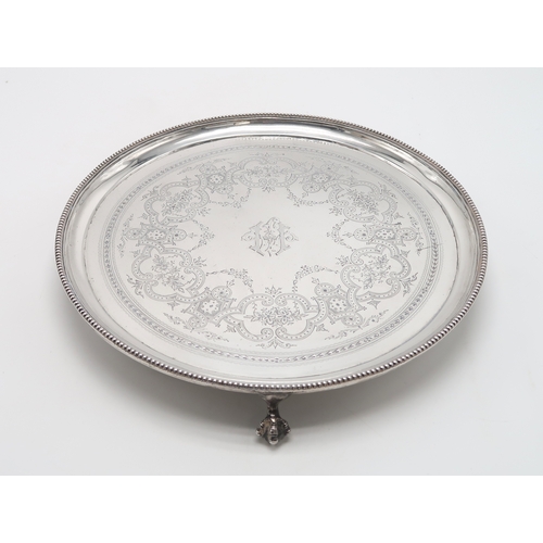 2453 - A VICTORIAN SILVER SALVERby Elkington & Co, London 1878, of circular form, with engraved geometr... 