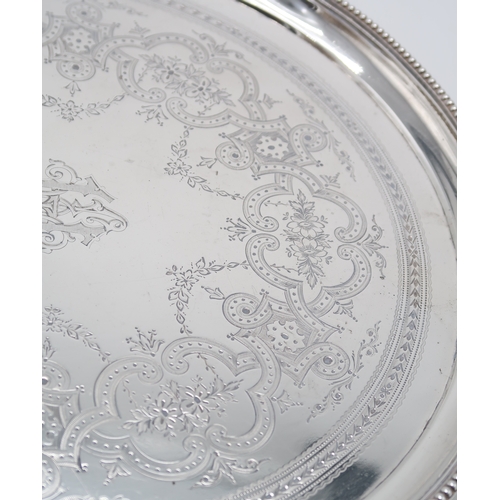 2453 - A VICTORIAN SILVER SALVERby Elkington & Co, London 1878, of circular form, with engraved geometr... 