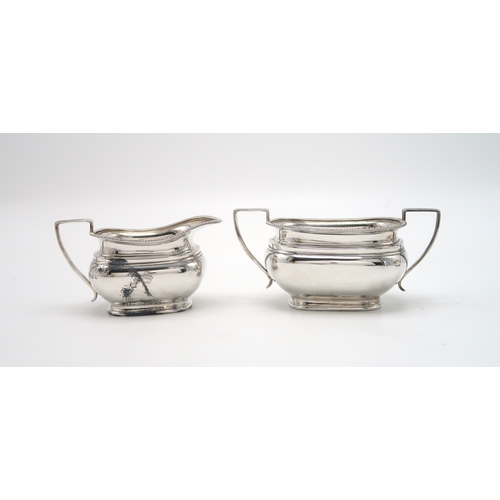 2454 - A GEORGE VI THREE PIECE SILVER TEA SERVICEby Edward & Sons, Sheffield 1937, of shaped rectangula... 