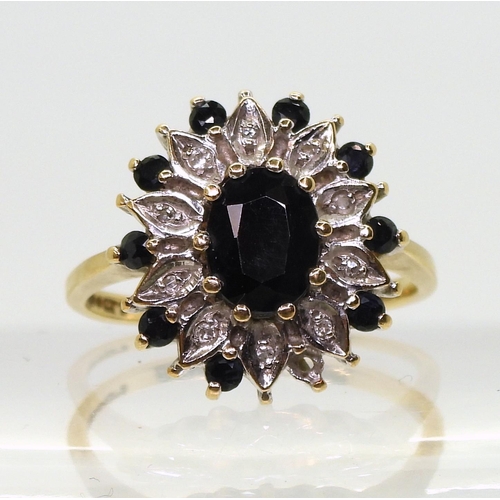 798 - A 9ct gold Sapphire and Diamond accent flower ring, size R1/2, weight 4.0gms 