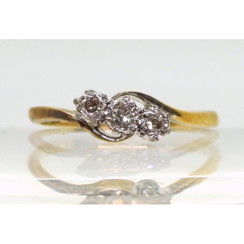 800 - An 18ct gold three-stone on a twist diamond ring, set with estimated approx 0.10cts brilliant cut, s... 