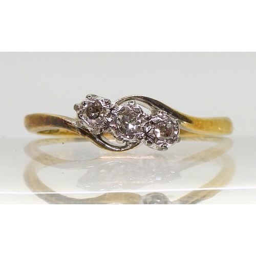 800 - An 18ct gold three-stone on a twist diamond ring, set with estimated approx 0.10cts brilliant cut, s... 