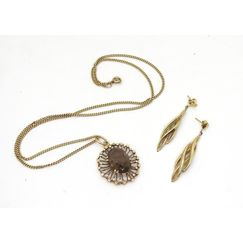 811 - A 9ct gold retro smoky quartz pendant and 50cm chain, weight 9.8gms together with a pair of 14k gold... 