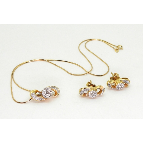 813 - An 18ct gold diamond flower pendant with matching earrings, the pendant is set with estimated approx... 