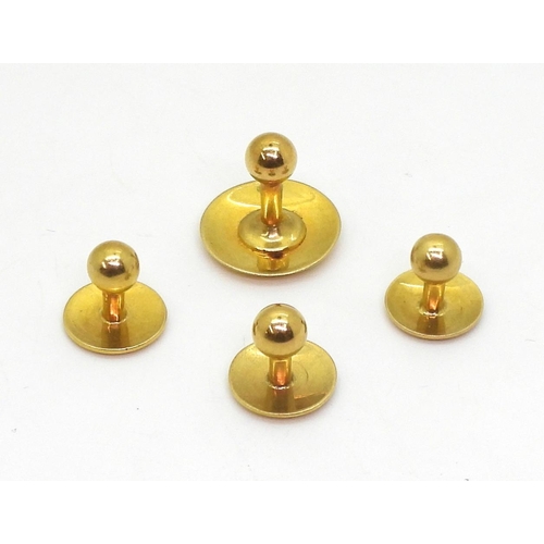 822 - Four 18ct gold shirt studs, weight together 8.9gms