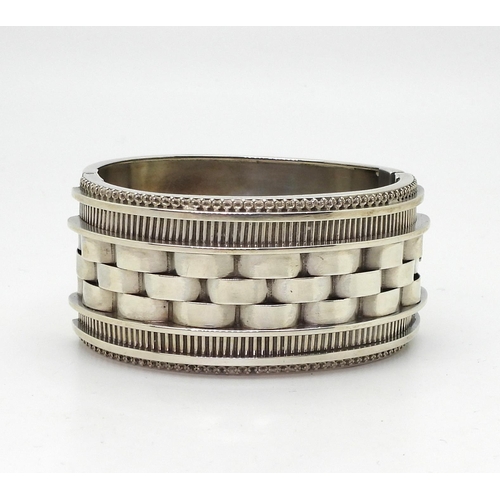 A Victorian silver bangle, hallmarked Birmingham 1882, makers mark