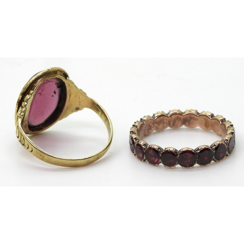 801 - A 14ct gold garnet ring, stamped 585 size approx M, weight 3.8gms, together with a rose-coloured met... 