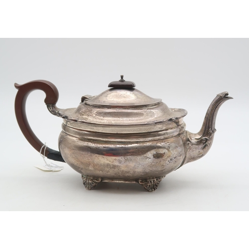 362 - A George V silver teapot, London 1928, of squat oval form, on four bracket feet, with a scrolling ri... 