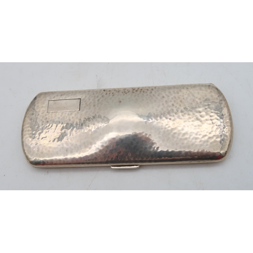 385 - A cased pair of silver spectacles, the stamped sterling case with hammered decoration and a vacant r... 