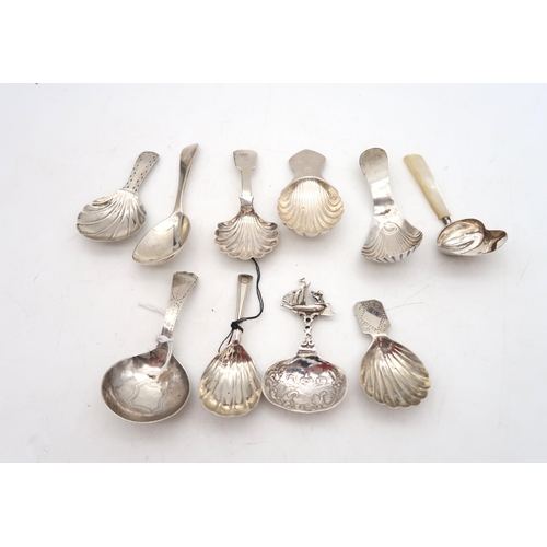 A collection of Georgian and later silver caddy spoons,
