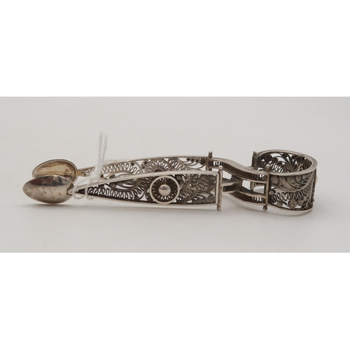 403 - A pair of German silver filigree sugar tongs, another Georgian pair by John & Henry Lias, London... 