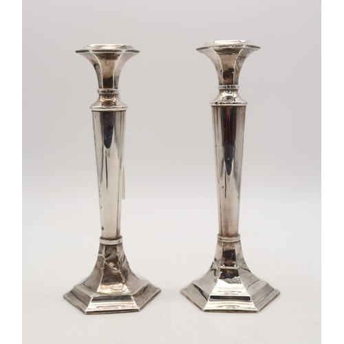 405 - A pair of silver candlesticks, by William Adams, Birmingham, of tapering cylindrical form, on hexago... 