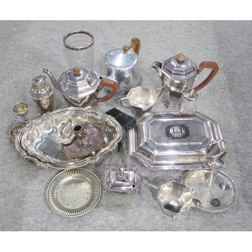 414 - A collection of EPNS including a four piece tea set, tureens, casters, dishes, chamber sticks etc