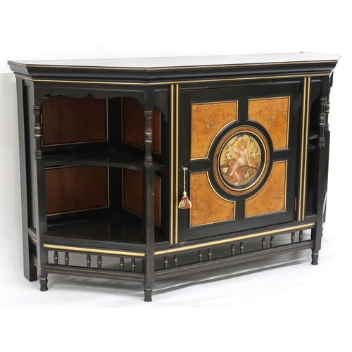 63 - A VICTORIAN AESTHETIC MOVEMENT EBONISED AND GILT CABINET shaped top with moulded cornice over single... 