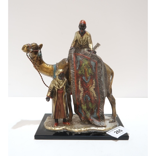 265 - A cold painted table striker, modelled as two carpet sellers and a camel, in the style of Franz Berg... 