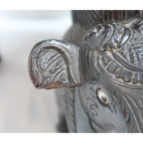 274 - A pink, white and black glass dish in stand, together with a carved table top table with elephant le... 