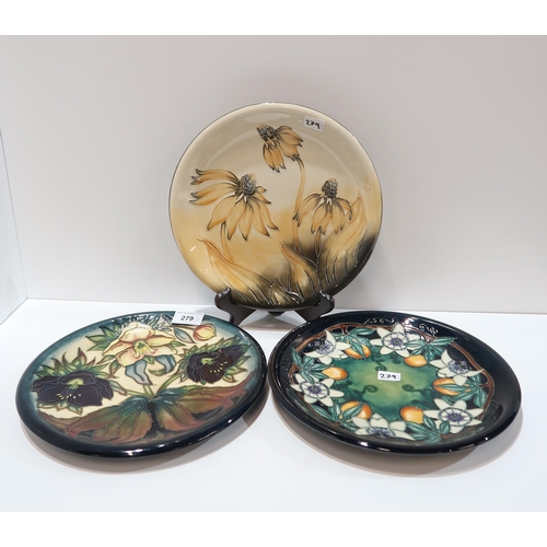 279 - Three Moorcroft plates in Fritillary, Coneflower and Passion flower patterns, all 25.5cm diameter